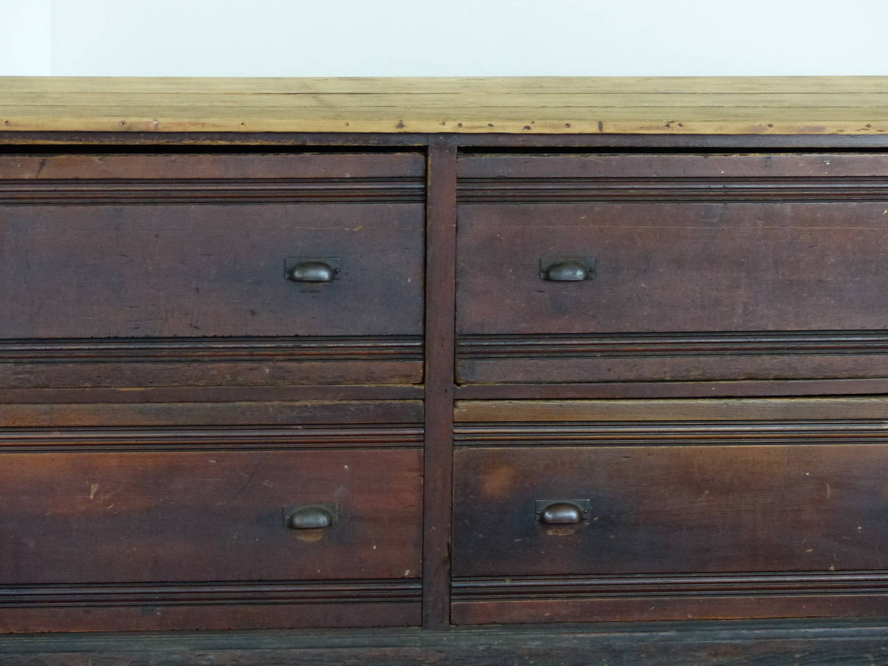 Large wood store counter with 6 oversize drawers with great millwork. Original finish with a scrubbed top and drawer pulls. Found in NY city