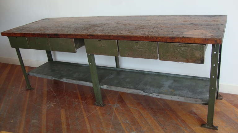 Heavy patina maple top on steel frame with bottom shelf and six drawers