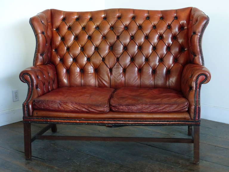 Good quality worn leather sofa in fine condition with worn pattern. 
Solid , confortable and purchased in NYC in the 50's.