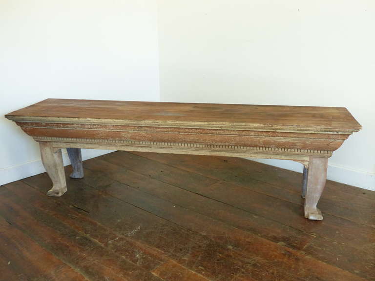 Wooden detailed store display piece in solid wood with heavy cornice detailing balanced with old age cracked soft worn surface paint.
 
Make a great console or sofa table.