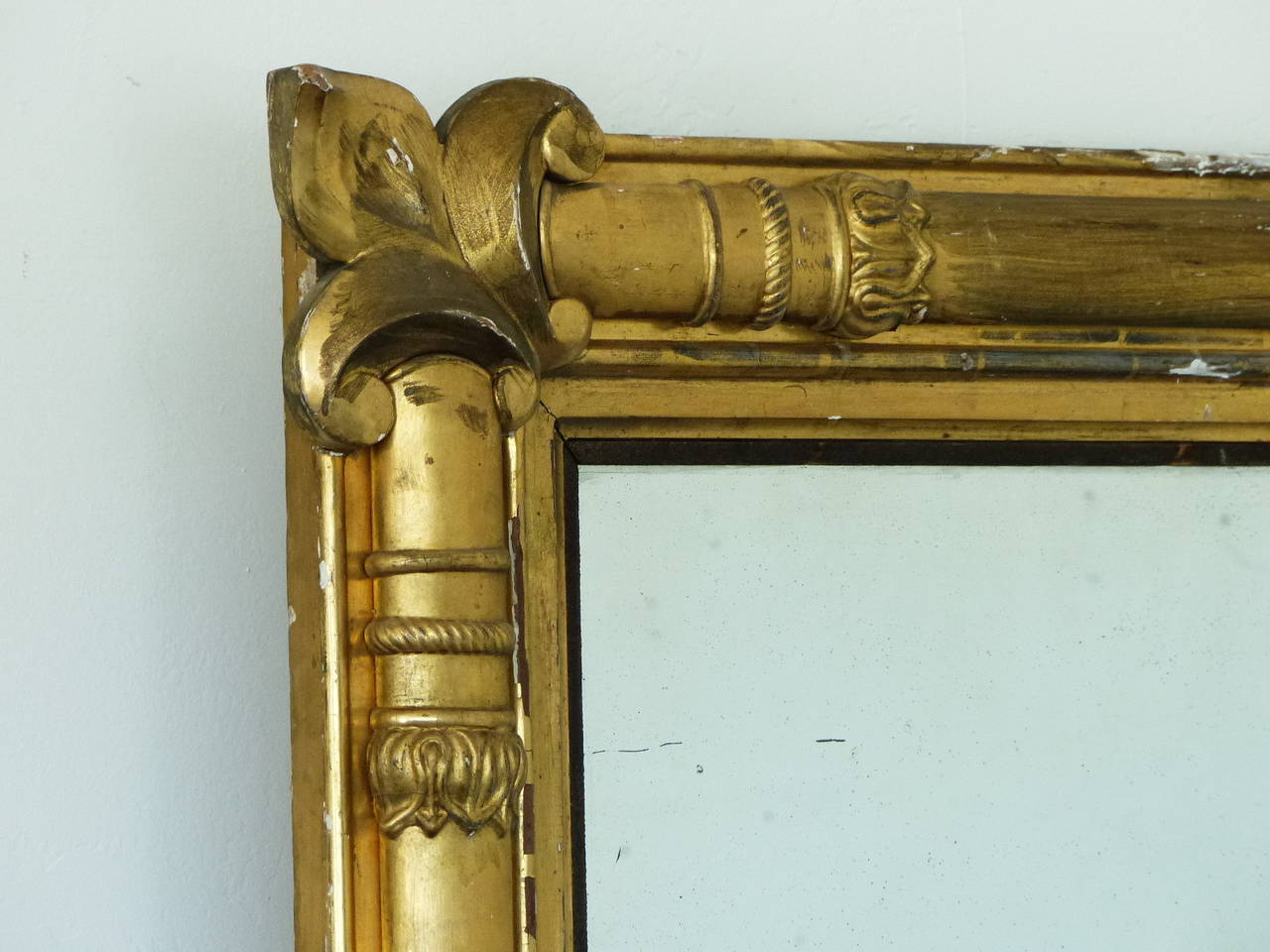 This is a detailed gilded two-pane mirror salvaged from a building in eastern USA with wonderful french details in the corners showing signs of worn gold guild.
circa 1850 with the bottom section retaining its original mirror
35×68 very well