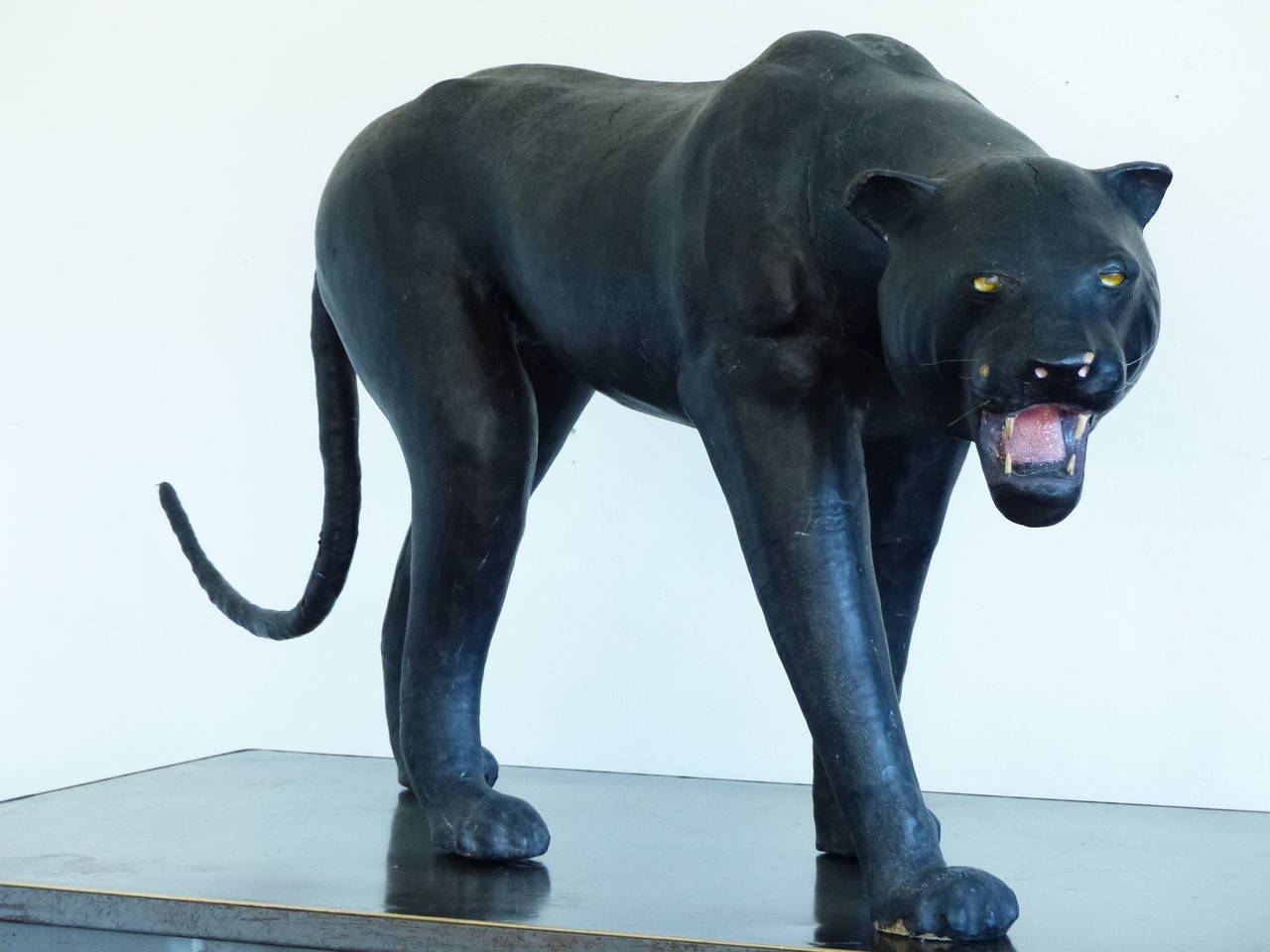 Vintage leather full size sculpture of a black panther with magnificent details and great patina . The stretched leather is applied over papier mache and wood. Research shows possible attribution to French Artist Paul Jouve (1880-1973). 
Showing