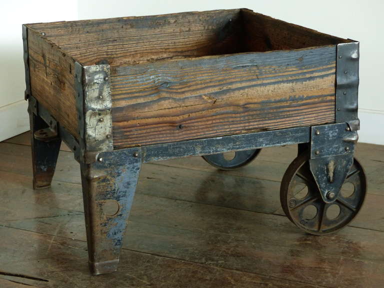 Early 20th century industrial cart now used as a coffee table or storage bin