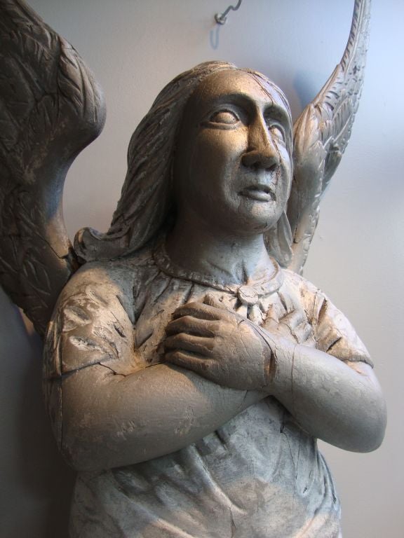 Beautiful carved wooden architectural bracket in the form of an angel with strong original paint. These items  were found on a building in Chicago ...research pending.
