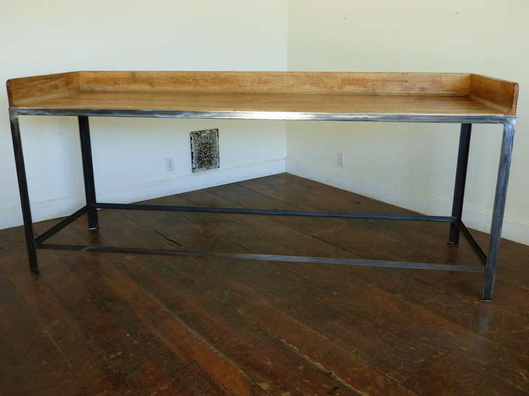 Maple industrial work station with steel legs and splash on three sides.