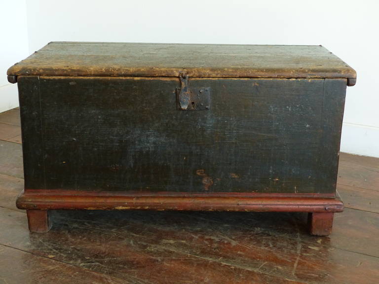 Very early Quebec painted blanket box in first surface paint. Pine with original lock and hinges.