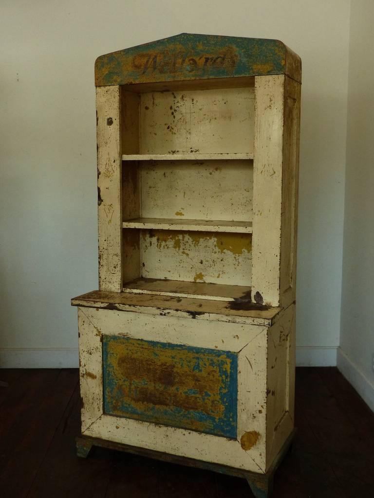 Display cabinet from the Willard's chocolate factory in Toronto. Used for display. Although built in the step-back form, this piece is all metal, with age cracked original painted surface.