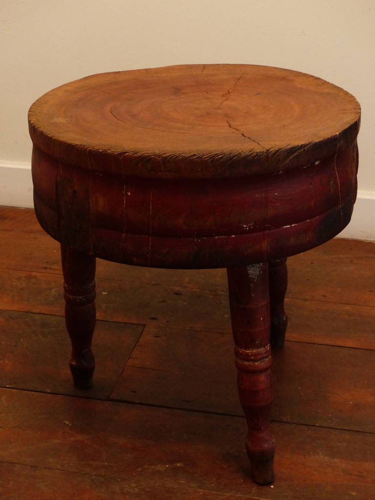 Maple butcher block with traces of red paint on legs, low profile for use as small end table
