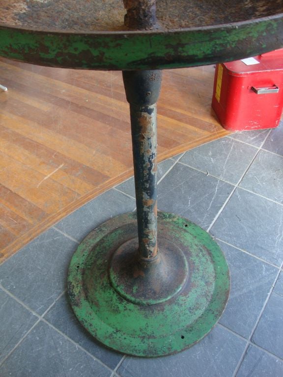 Cast iron bird bath with decorative details and nice patina on the green finish.
