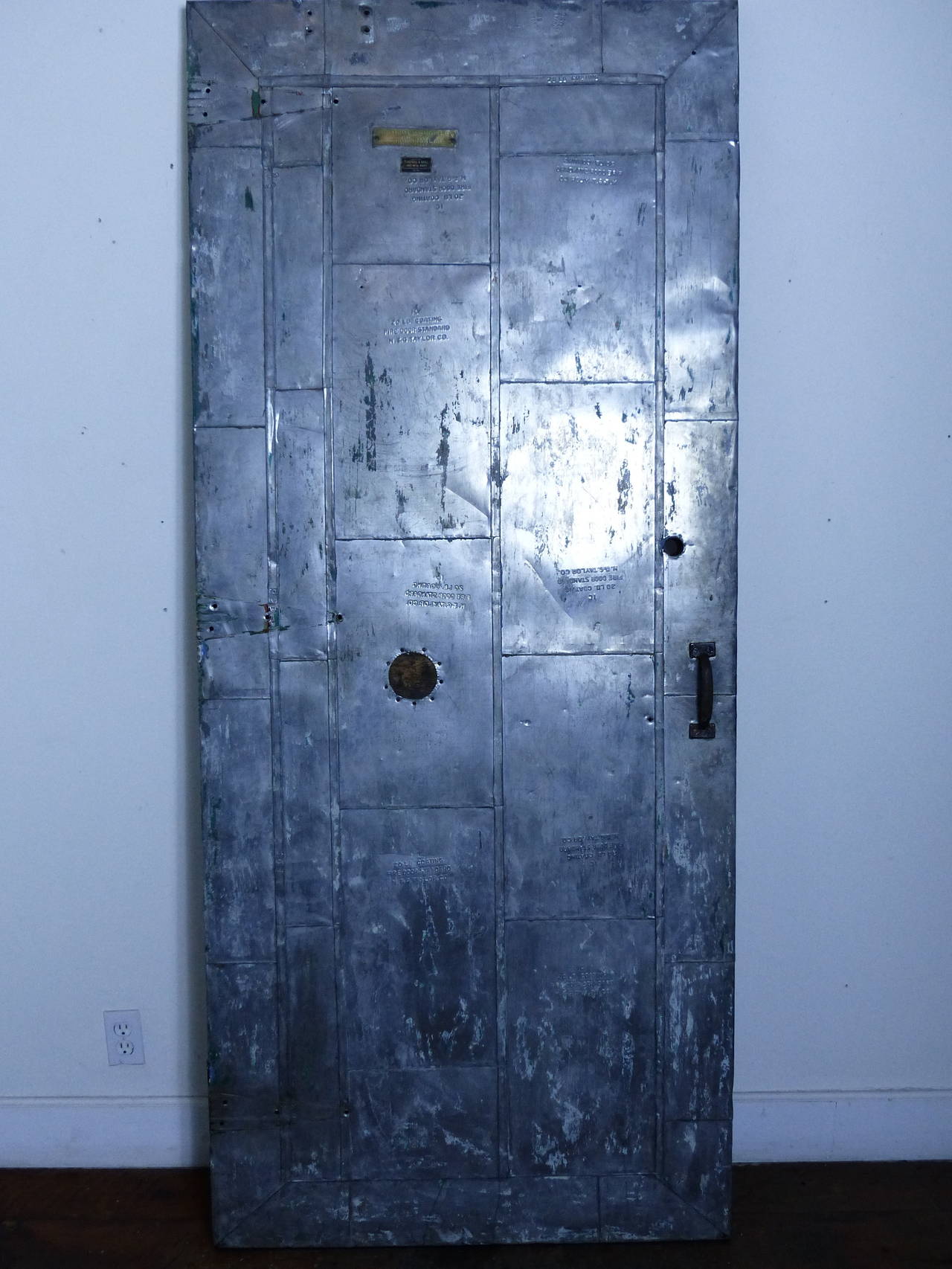 Cleaned and polished Industrial fire door, easily adapted to track system,
circa 1910 solid core with panelled style tin surfacing.

We have several sizes in stock.