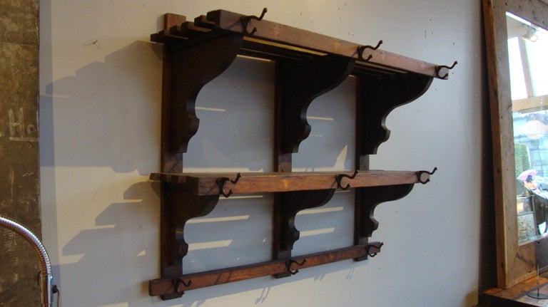 Oak coat rack with two shelves and multiple hooks