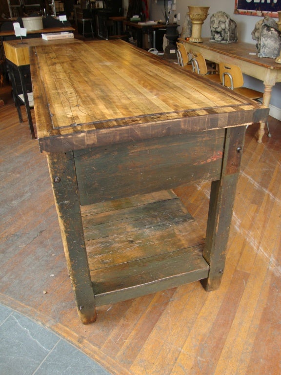 Nice working island/workbench with solid through drawers in old green finish and solid maple top. Rare configuration,draper style shelf circa 1890. Made in Hamilton Ontario