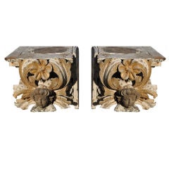 Pair of carved gilt wood Italian capital with putti