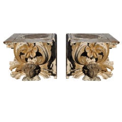 Pair of carved gilt wood Italian capital with putti