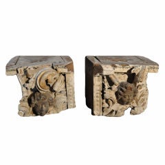Pair of carved wood italian capital with putti