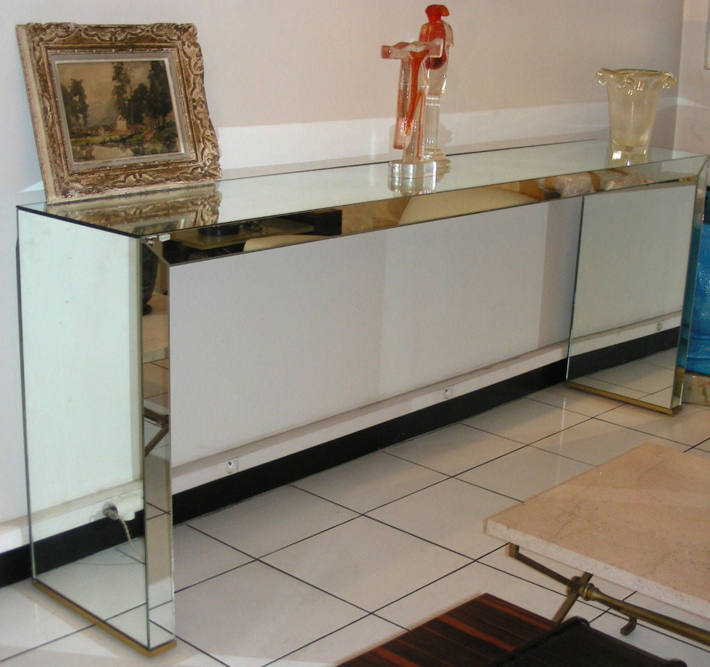 Large console in mirror and base in guilden bronze.