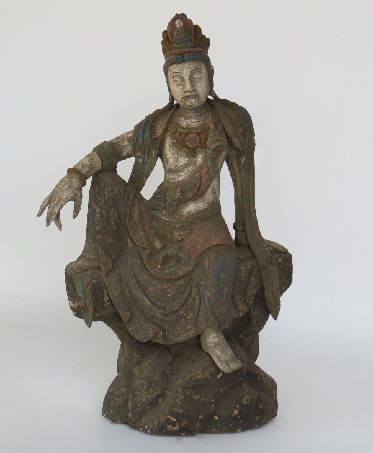 Quan Yin sculpture in seating position.