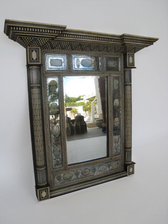 Ebony, wood and bone mirror and frame.