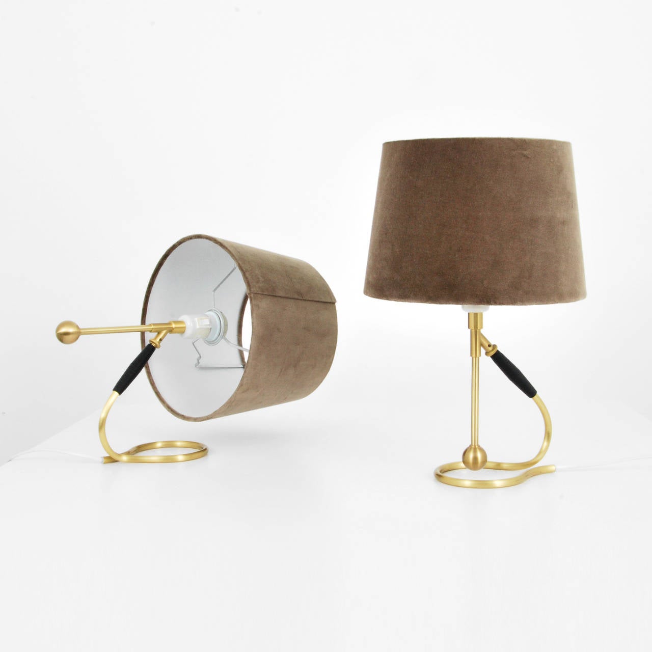 Lamps are model #306 and may be used as table lamps or sconces by Kaare Klint.
