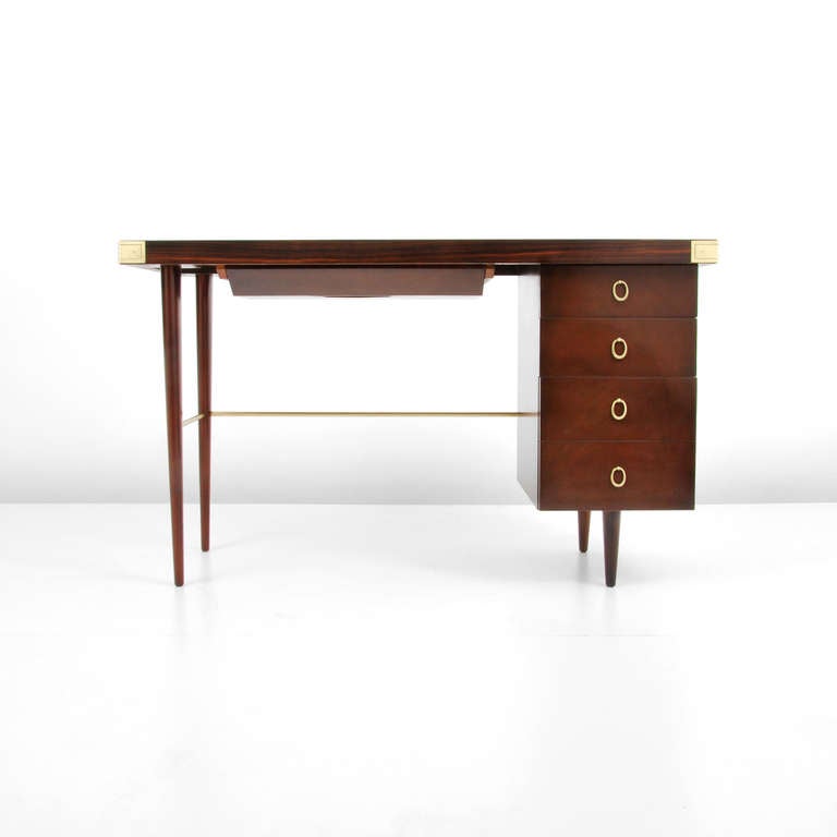 DESIGNER & MANUFACTURER: Walter Charak 

MARKINGS: marked

COUNTRY OF ORIGIN & MATERIALS: USA; rosewood top, mahogany lower, brass

ADDITIONAL INFORMATION:  Rosewood top desk with mahogany legs and  four mahogany drawers, brass accents and
