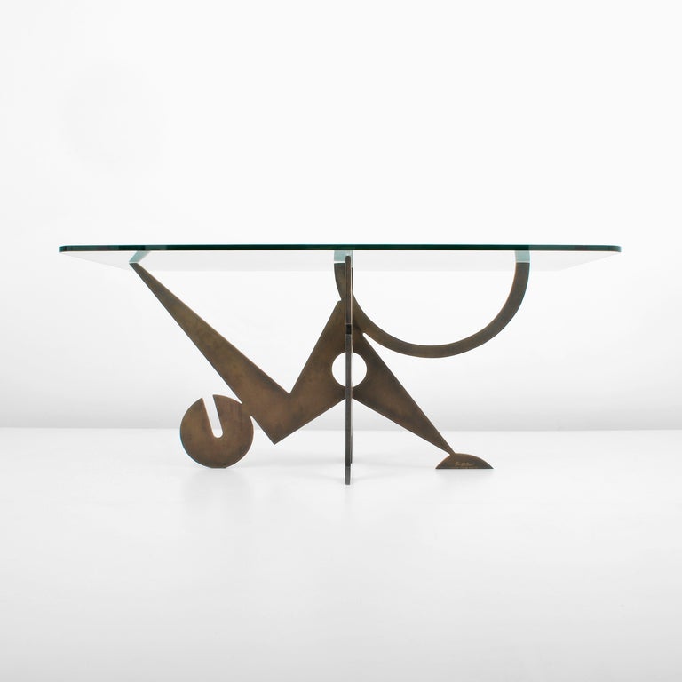 DESIGNER & MANUFACTURER: Pucci de Rossi (1947-2013)

MARKINGS: marked, dated 1987

COUNTRY OF ORIGIN & MATERIALS: France; steel, glass

ADDITIONAL INFORMATION: Wonderfully designed dining table crafted with two pieces of interlocking patinated