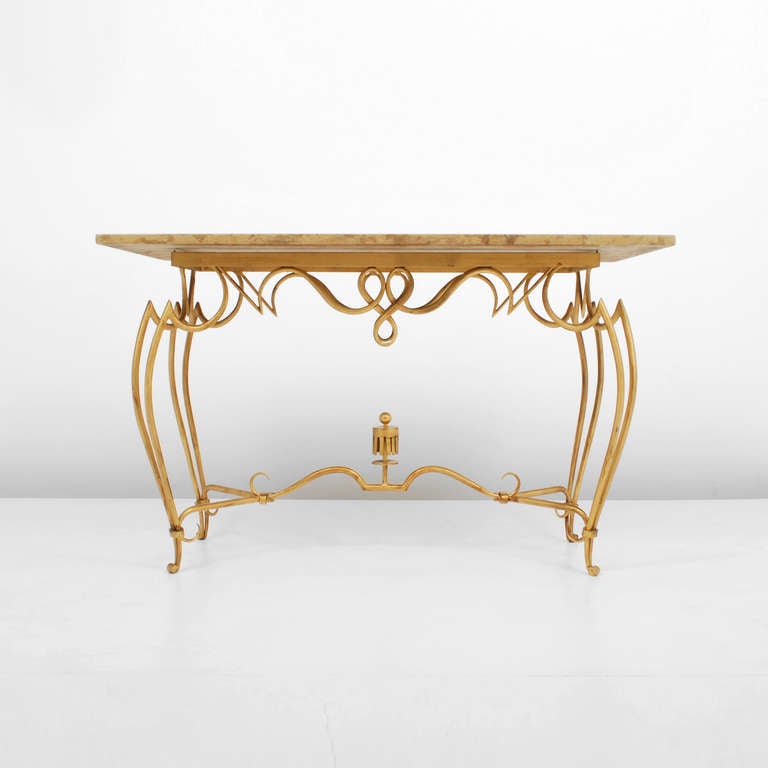 Console/sofa table by Rene Drouet. Elegantly designed and crafted gold gilt metal base supporting a marble top.