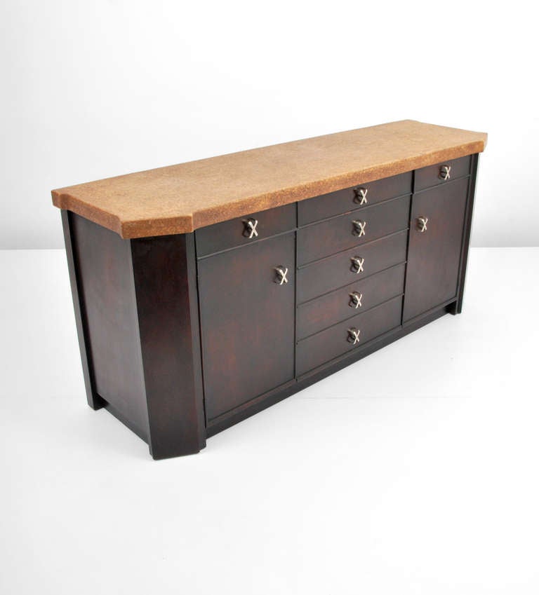 DESIGNER & MANUFACTURER: Paul Frankl (1886-1958); Johnson Furniture Co.

MARKINGS: marked

COUNTRY OF ORIGIN & MATERIALS: USA; wood, cork, metal

ADDITIONAL INFORMATION & CIRCA: Cabinet/server/buffet with cork top, 