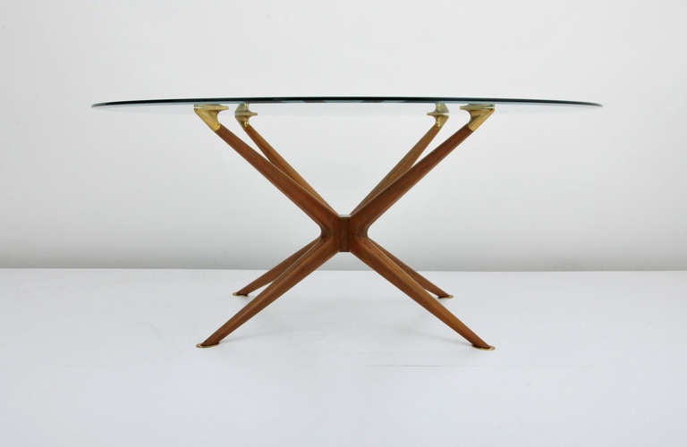 DESIGNER & MANUFACTURER: Dining Table in the Manner of Ico Parisi

MARKINGS: none

ORIGIN & MATERIALS: Italy; brass, wood

ADDITIONAL INFORMATION: Wonderfully designed dining table with brass sabotsin the manner of Ico Parisi.

DIMENSIONS: