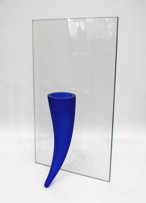 Fine "Petite Etrangete Contre Un Mur" vase by French designer Philippe Starck for Daum, France. Wonderful minimalist design with thick, vibrant cobalt blue glass against clear glass that allows the vase to be free standing. Signed.   


