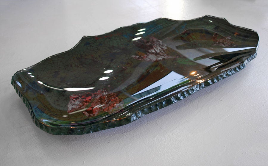 Rare and large enamel under glass charger/centerpiece platter designed by Duilio (Dube) Berabe for Fontana Arte. Wonderfully designed and crafted with a thick, clear hand blown glass top and a naturalistic, serrated edge. Signed.  

*Notes: There