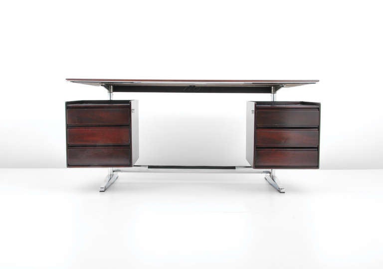 DESIGNER & MANUFACTURER: Alberto Rosselli (1921-1976); Rima

MARKINGS: marked

COUNTRY OF ORIGIN & MATERIALS: Italy; rosewood, chromed steel, plastic

ADDITIONAL INFORMATION: Rosewood desk with six drawers by Alberto Rosselli. 

