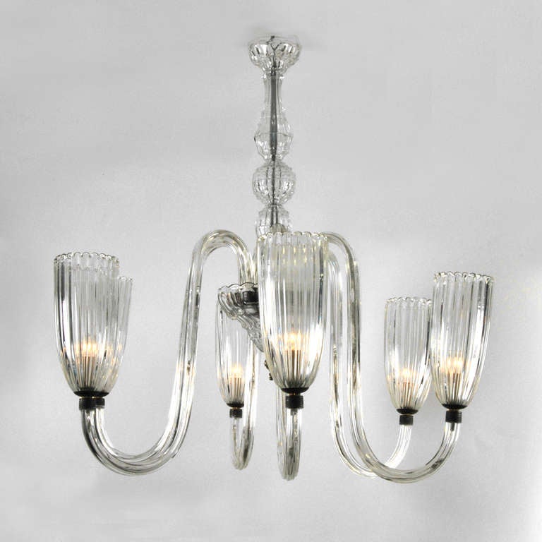 Chandelier in the manner of Barovier & Toso, Murano, Italy. Beautifully designed, elegantly proportioned, six-arm chandelier with clear hand blown glass arms with tall and elegant ribbed and scalloped bobeche bowls.