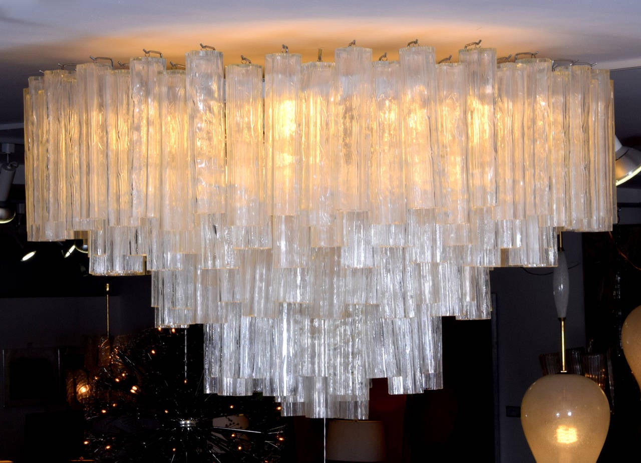 Monumental blown glass chandelier by Camer and in the manner of Venini. Beautifully designed, elegantly crafted work with over one hundred and fifty shaped and textured glass drops hanging from five different tiers.
