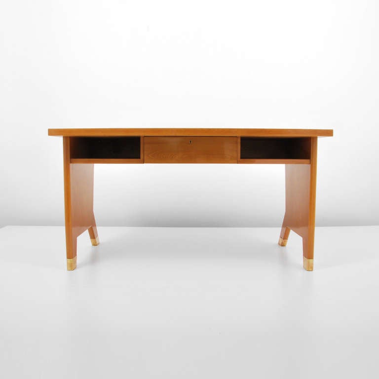 Rare desk with a matching wall shelf by Gio Ponti. Desk has splayed front legs, a single drawer, open storage areas, and brass sabots. 

Provenance: Copy of Certificate of Expertise from the Gio Ponti Archives.

  