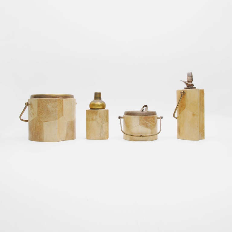 DESIGNER & MANUFACTURER: Aldo Tura
 
MARKINGS: marked

COUNTRY OF ORIGIN & MATERIALS: Italy; lacquered goat skin over wood, metal

ADDITIONAL INFORMATION: Fine & rare Aldo Tura bar set consisting of one large, and one small ice bucket, one set