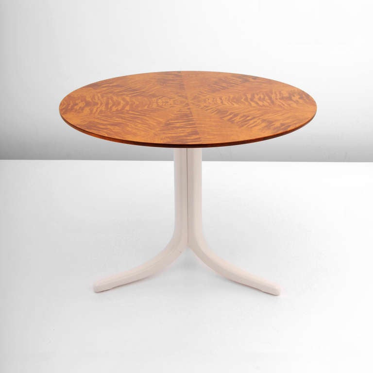 Fine occasional or side table by Joseph Frank for Svenska Tenn. Beautiful and elegant pyramid-cut figured mahogany burl wood top on a painted clustered pedestal base with three down swept legs. 

Materials: mahogany burl wood.

 