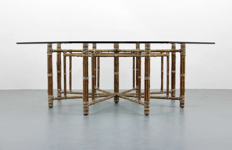DESIGNER & MANUFACTURER: McGuire 

MARKINGS: none

COUNTRY OF ORIGIN & MATERIALS: USA; bamboo, rawhide, glass

ADDITIONAL INFORMATION: Large octagonal, beveled glass top dining/center hall table constructed with bamboo poles and stretchers
