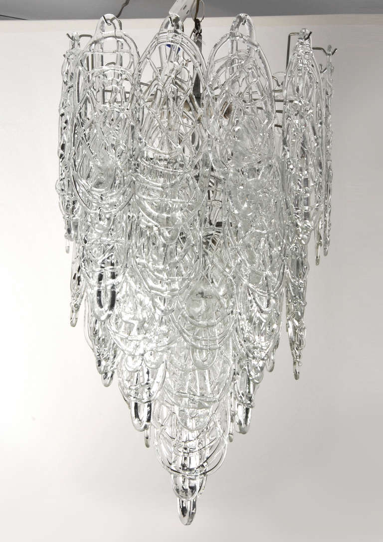 Large Italian multi-tiered, glass-disk chandelier by Mazzega, Murano, Italy. 

DIMENSIONS: 31"h, 19"dia (fixture only).