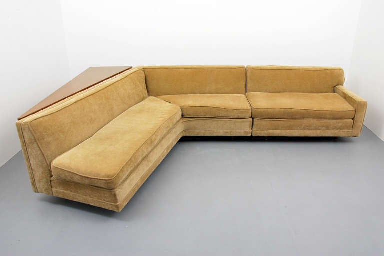 Two-piece sectional sofa/couch with angled sofa table by Harvey Probber. Sofa retains Harvey Probber label.