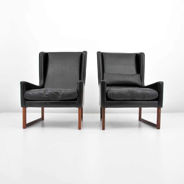 Scandinavian Modern Pair of Danish Leather Wingback Chairs with One Footstool