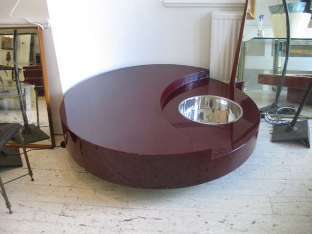 Circular revolving coffee table with bar