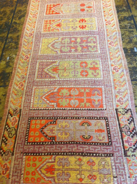 This is a Khotan rug with a very rare design from the 1880's.