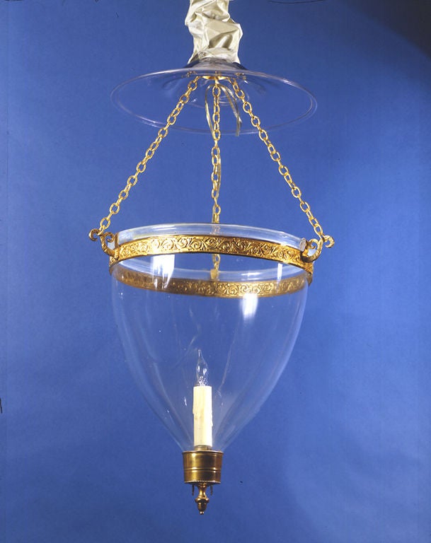 English
Regency lantern, circa 1800.
Glass, blown, with gilt-brass fittings
27 in. high, 13 1/4 in. greatest diameter.

In a market that is overwhelmed with reproduction lanterns of this type, period examples are extremely rare. 

Condition: