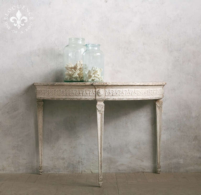 Absolutely stunning Antique demi-lune console in a cloudy gray faux marble finish, adorned with geometric carving. Truly unique and beautiful.  Beautiful piece for an entry or hallway to add a chic old world flair!