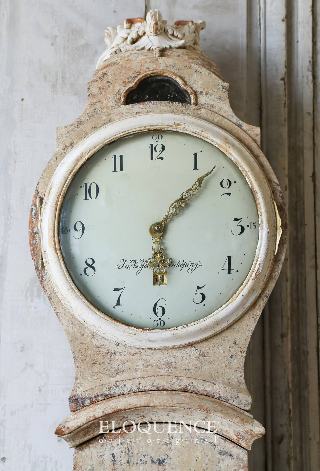 Stunning Swedish antique Rococo Mora clock in the original creamy beige with hints of charcoal and cherry toned wood peeking through. The interior of the clock is a vibrant tangerine and the tiniest bit of dark periwinkle. The floral carvings are a