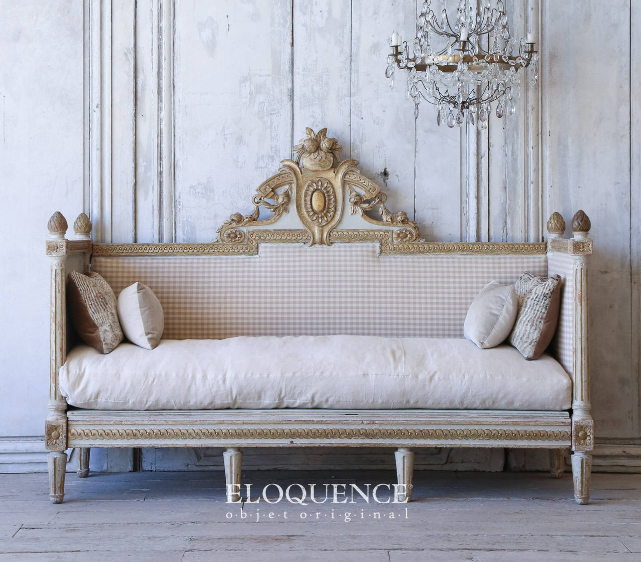 Incredible Swedish antique Gustavian period daybed in the original eggshell finish and gilt highlights. The gorgeous pinecone finials, rosettes and mouldings are stunning. This piece is upholstered in sunny yellow and white checker. The frame is