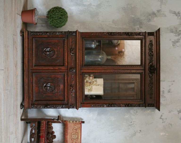Antique Oak Hunting Cabinet from Belgium.  Hand-carved birds and fruits adorn the cupboard doors and drawers.