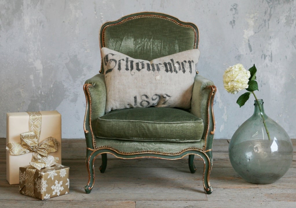Beautiful old serpentine Louis XV style Bergere in deep green paint finish with gilt highlights.  Upholstery is old green mohair.  Plush and gorgeous!