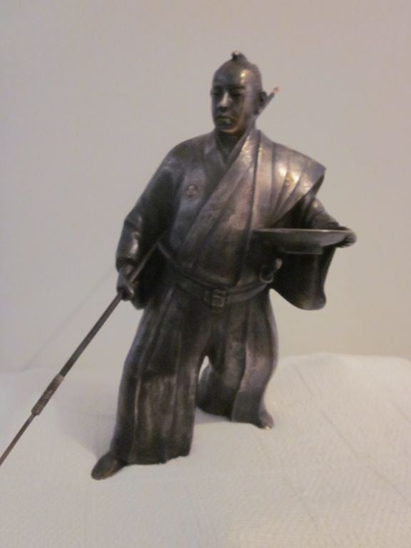 Wonderfully modeled silvered bronze Japanese samurai with gilt bronze highlights.  2 removable weapons - a katana (long sword) and a naginata (long lance).  French made for the Japanese market.