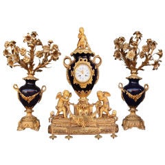 XIX th century bronze and Sevres porcelain clock set XIX th century bronze and Sevres porcelain clock set